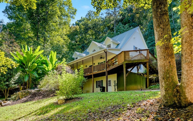 back of property featuring a deck