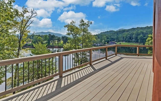 deck featuring a water and mountain view