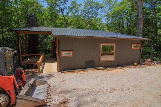 LOT3 Big Crk, Blue Ridge, GA 30513 - view of side of home with a metal roof, a deck, a chimney, and view of wooded area