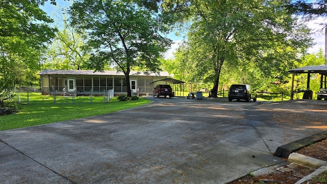 5451 Sampson Rd, Young Harris, GA 30582 - view of front of home featuring driveway, a sunroom, and a front lawn