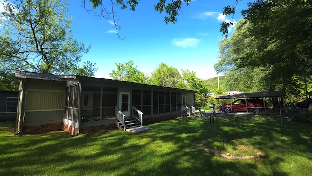 5451 Sampson Rd, Young Harris, GA 30582 - back of property with a sunroom, a carport, and crawl space