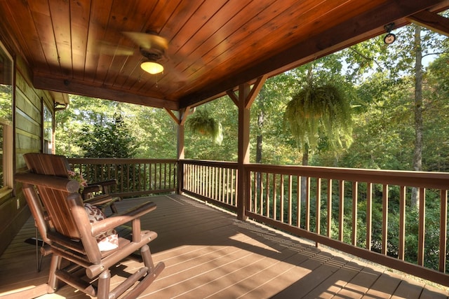 wooden deck featuring ceiling fan