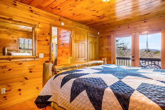 bedroom with wooden ceiling, access to outside, and french doors