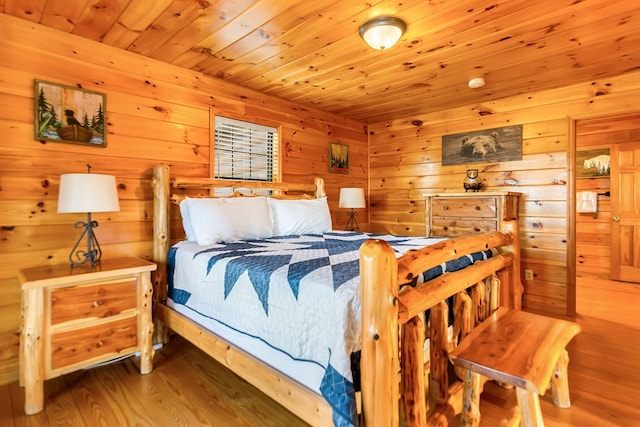 bedroom with hardwood / wood-style flooring and wood ceiling