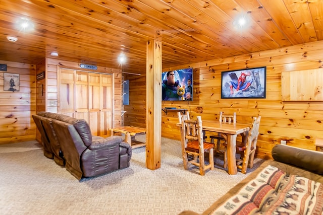 living room featuring carpet floors and wood ceiling