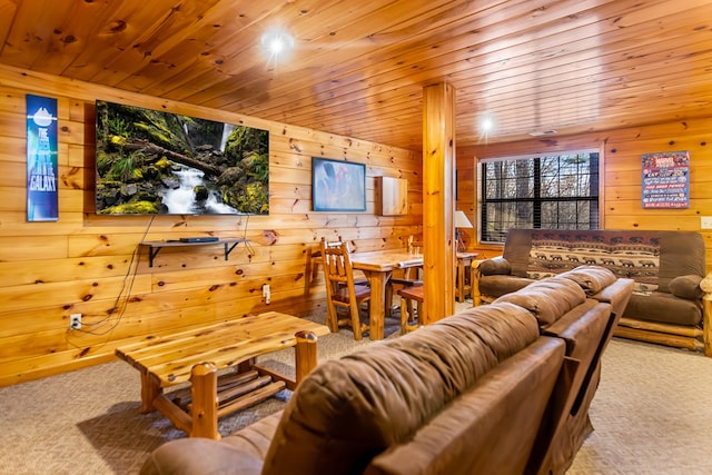 carpeted living room featuring wooden walls and wood ceiling