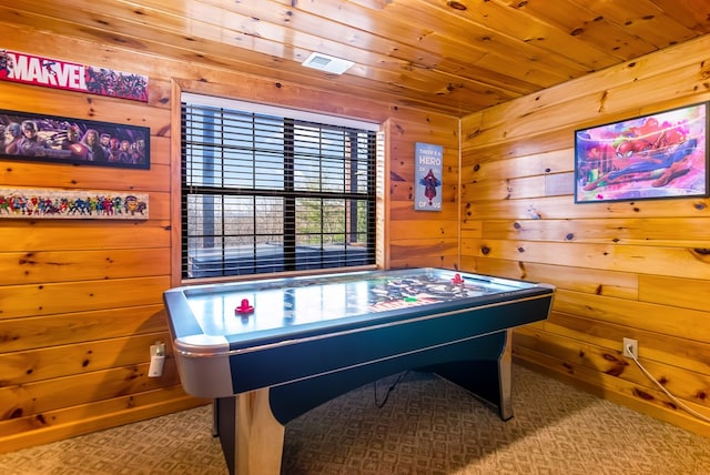 playroom featuring wood walls, wooden ceiling, and carpet floors