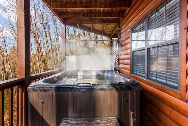 deck with a hot tub