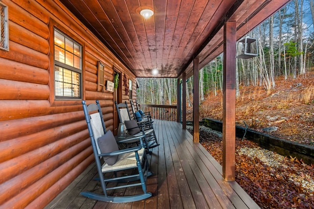 wooden terrace featuring a porch