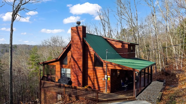 view of side of property featuring a deck