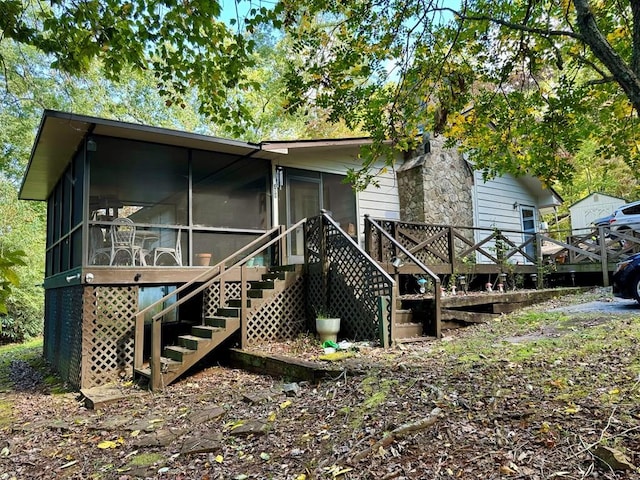 back of property featuring a sunroom