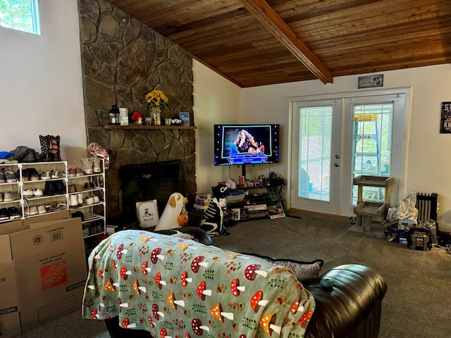 living room featuring a stone fireplace, french doors, carpet, wooden ceiling, and vaulted ceiling with beams