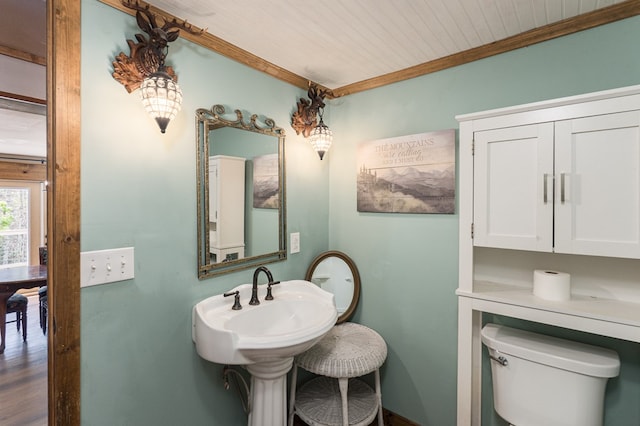 bathroom featuring crown molding, toilet, wood finished floors, and wood ceiling