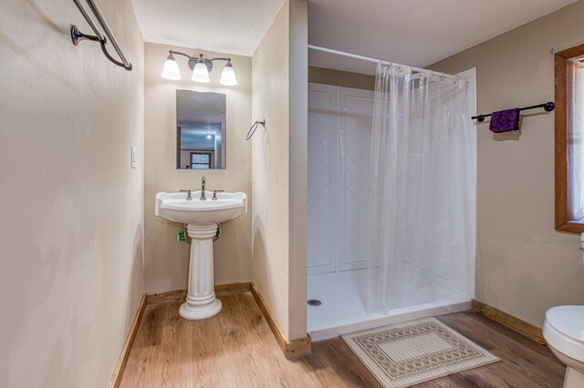 1244 Cook Creek Rd, Murphy, NC 28906 - bathroom with wood finished floors, baseboards, a stall shower, and toilet
