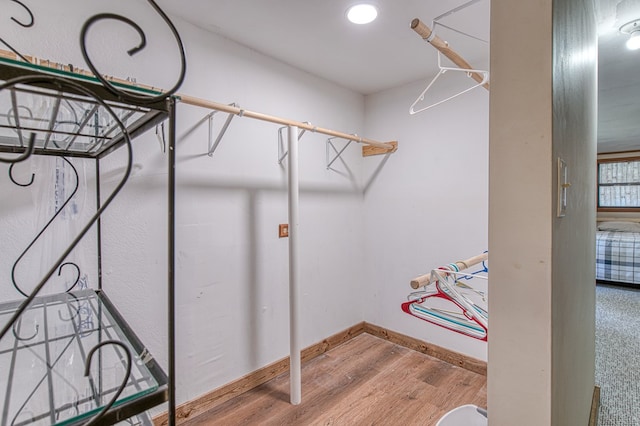 spacious closet featuring wood finished floors