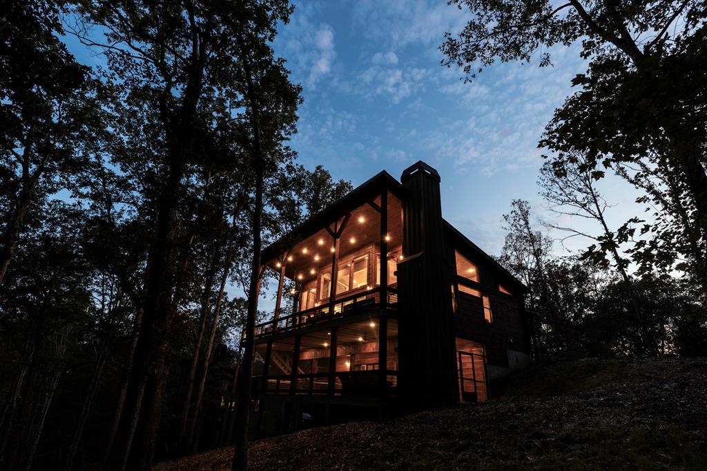 view of back house at dusk