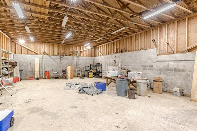 miscellaneous room with a garage and concrete block wall