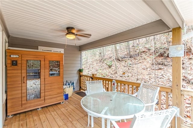 wooden deck featuring ceiling fan and outdoor dining area