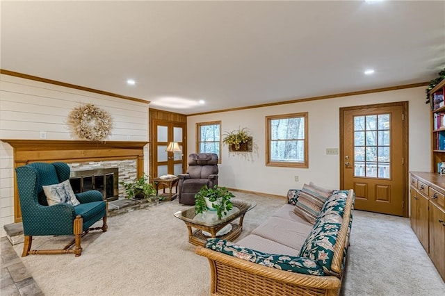 living area with a fireplace, ornamental molding, light colored carpet, and recessed lighting