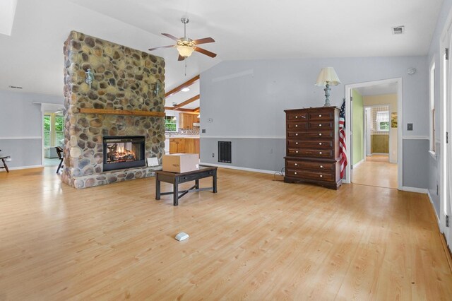 59 Tusquittee Creek Ln, Hayesville, NC 28904 - living room with a stone fireplace, ceiling fan, plenty of natural light, wood finished floors, and vaulted ceiling