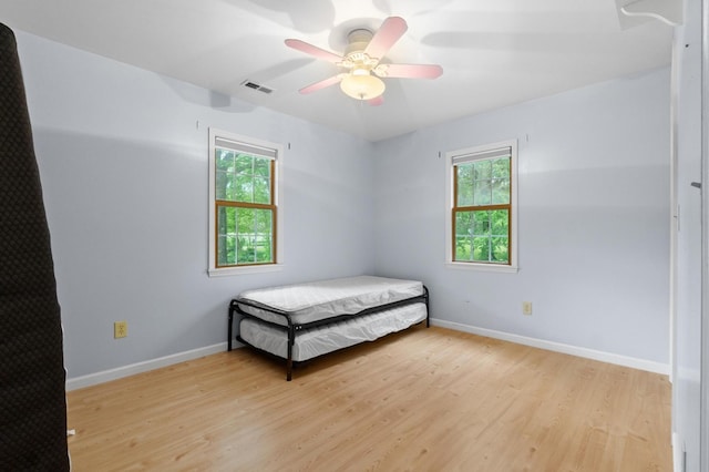 59 Tusquittee Creek Ln, Hayesville, NC 28904 - bedroom featuring multiple windows, light wood-style flooring, and baseboards