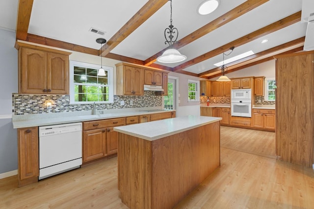 59 Tusquittee Creek Ln, Hayesville, NC 28904 - kitchen featuring white appliances, light wood finished floors, light countertops, backsplash, and under cabinet range hood