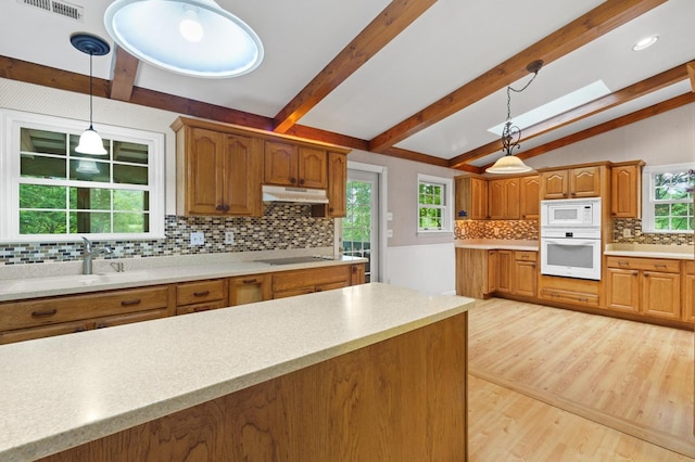 59 Tusquittee Creek Ln, Hayesville, NC 28904 - kitchen with white appliances, a sink, backsplash, light wood-type flooring, and light countertops