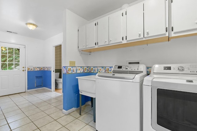 59 Tusquittee Creek Ln, Hayesville, NC 28904 - washroom with cabinet space, washer and dryer, and light tile patterned floors