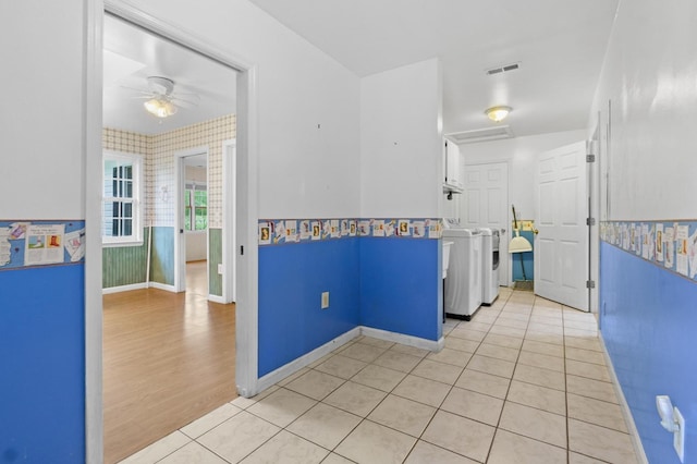 59 Tusquittee Creek Ln, Hayesville, NC 28904 - hall featuring wallpapered walls, baseboards, light tile patterned floors, and washer and clothes dryer