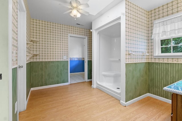 59 Tusquittee Creek Ln, Hayesville, NC 28904 - bathroom featuring wallpapered walls, wainscoting, wood finished floors, ceiling fan, and baseboards