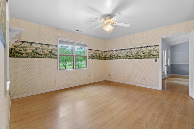 59 Tusquittee Creek Ln, Hayesville, NC 28904 - empty room featuring wallpapered walls, light wood-type flooring, ceiling fan, and baseboards