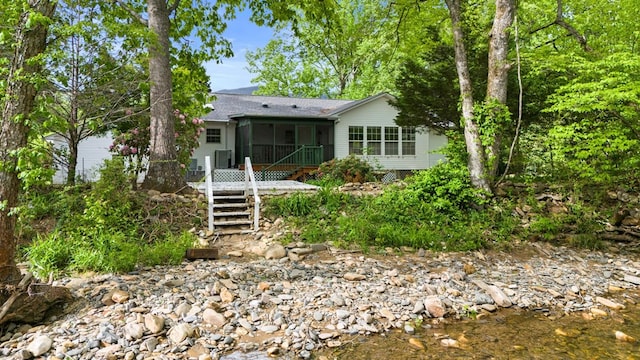 59 Tusquittee Creek Ln, Hayesville, NC 28904 - view of front of house featuring a sunroom, stairway, and a shingled roof