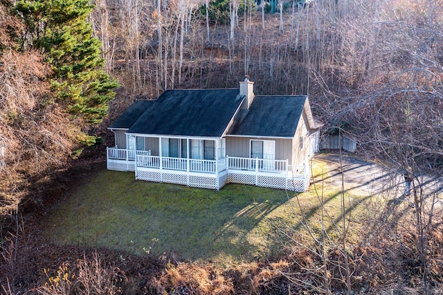 rear view of property with a yard