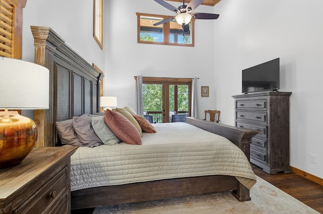 558 Tipton Springs Rd, Morganton, GA 30560 - bedroom with dark wood-style floors, baseboards, a towering ceiling, and a ceiling fan