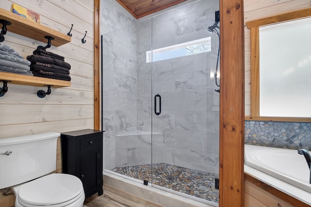 558 Tipton Springs Rd, Morganton, GA 30560 - bathroom featuring toilet, a stall shower, wood finished floors, and a bath