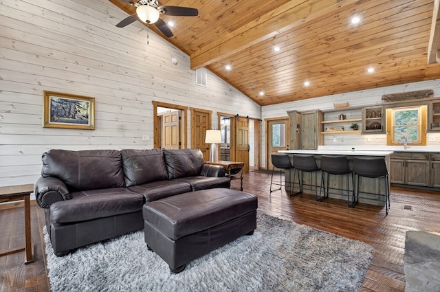 558 Tipton Springs Rd, Morganton, GA 30560 - living area with dark wood-style floors, wooden ceiling, wood walls, ceiling fan, and high vaulted ceiling
