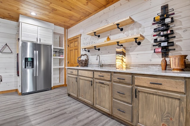 558 Tipton Springs Rd, Morganton, GA 30560 - kitchen featuring stainless steel fridge, open shelves, wood walls, a sink, and light wood finished floors