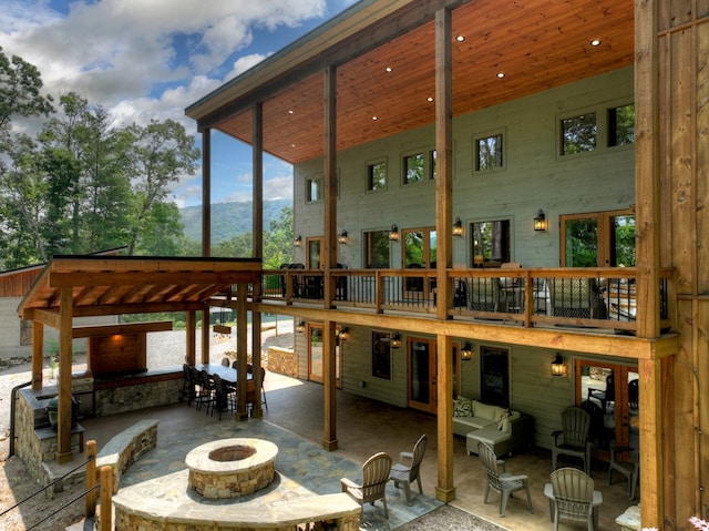 558 Tipton Springs Rd, Morganton, GA 30560 - view of patio / terrace with an outdoor living space with a fire pit