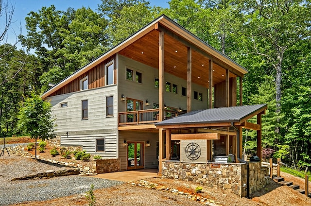558 Tipton Springs Rd, Morganton, GA 30560 - view of front of property with board and batten siding, a patio area, and stone siding