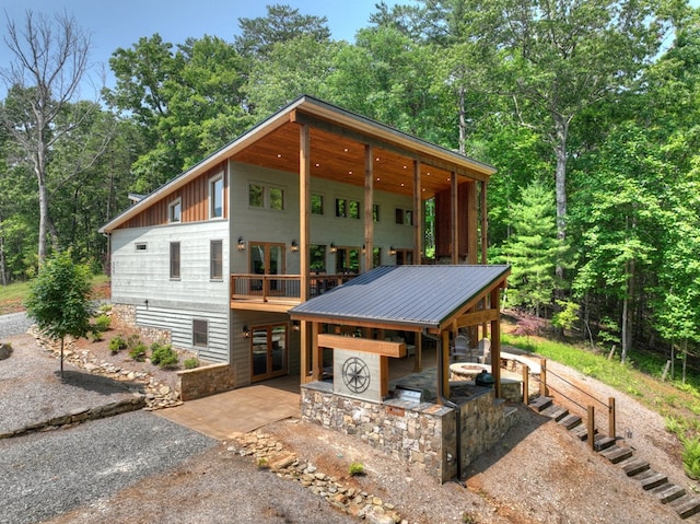 558 Tipton Springs Rd, Morganton, GA 30560 - view of front of house with french doors, a patio, and board and batten siding