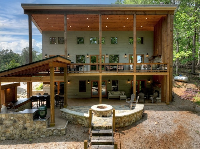 558 Tipton Springs Rd, Morganton, GA 30560 - rear view of property featuring a fire pit, a patio area, a deck, and a bar