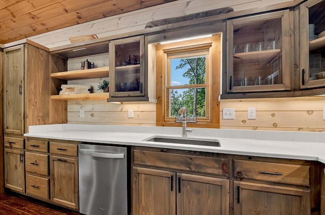 558 Tipton Springs Rd, Morganton, GA 30560 - kitchen featuring dishwasher, a sink, light countertops, wooden walls, and glass insert cabinets