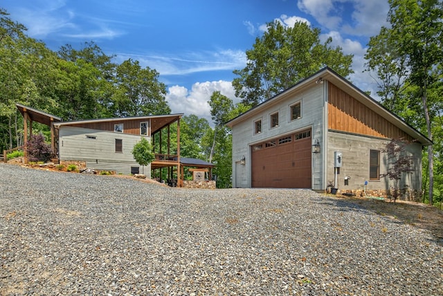 558 Tipton Springs Rd, Morganton, GA 30560 - view of side of home with a garage and board and batten siding