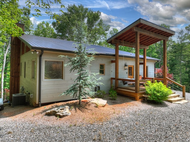 558 Tipton Springs Rd, Morganton, GA 30560 - view of front facade featuring metal roof, a deck, a chimney, and central air condition unit