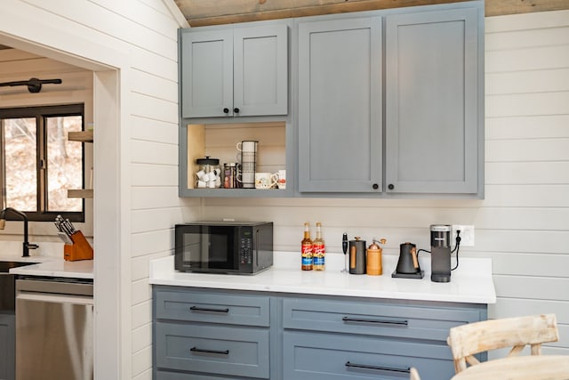 bar with dishwasher and wood walls