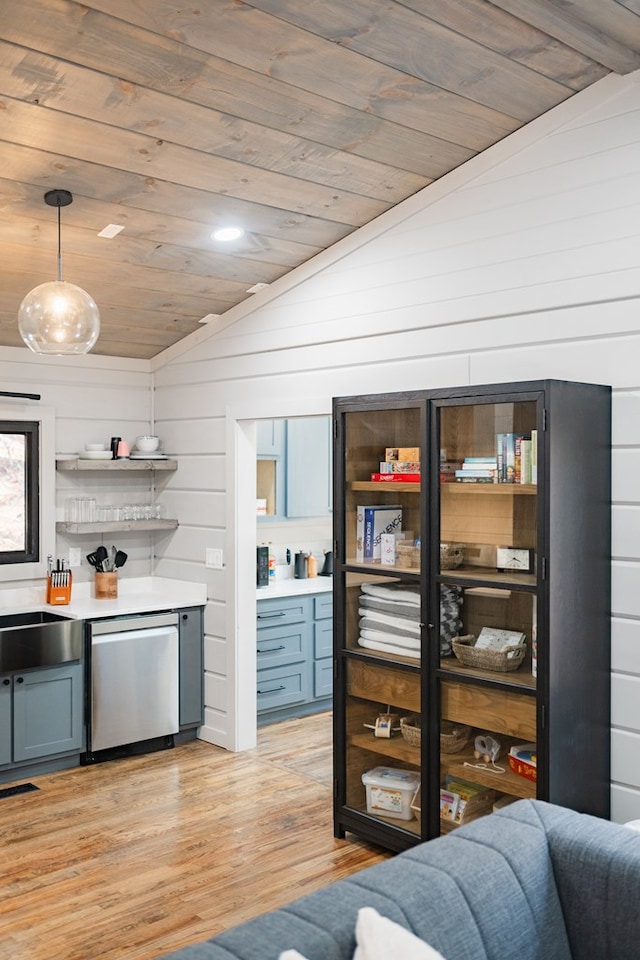 interior space with pendant lighting, wood ceiling, and vaulted ceiling