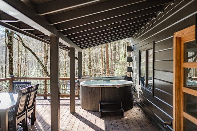 deck with a hot tub