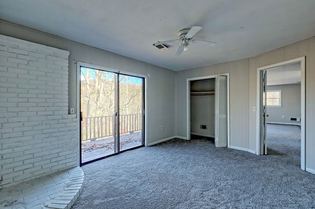 unfurnished bedroom featuring access to exterior, ceiling fan, a closet, and carpet