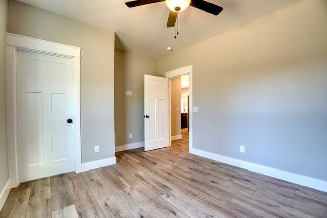 unfurnished bedroom featuring light hardwood / wood-style flooring and ceiling fan