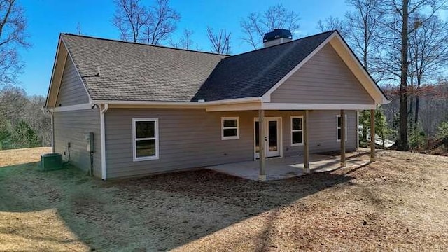 rear view of property with central AC unit and a patio area